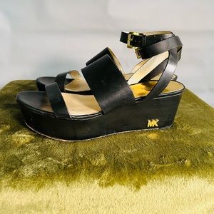 Michael Kors black platform sandal with ankle strap.